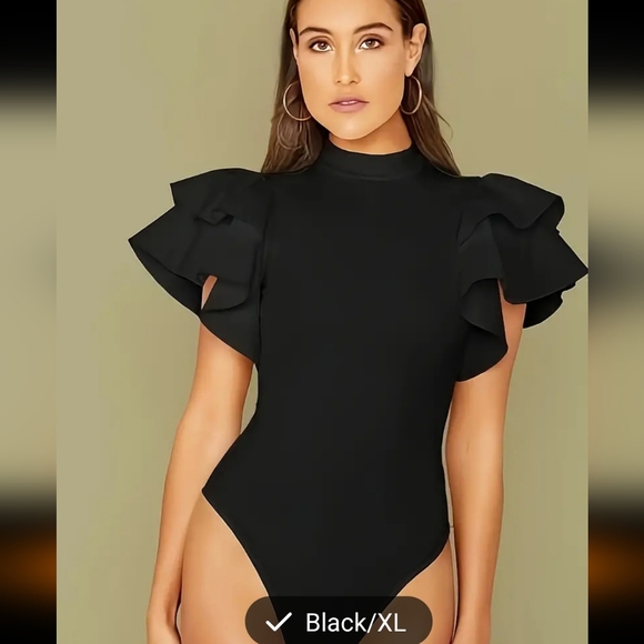 Gorgeous black knit bodysuit with layers of fabric pieces for sleeves. Snap clos - Picture 1 of 4